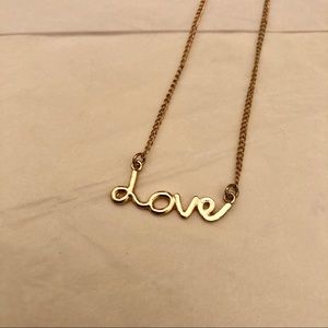 Gold Love Pendant Necklace from Claire’s